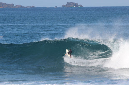 A surfer cathing a big wave in Gran Canaria